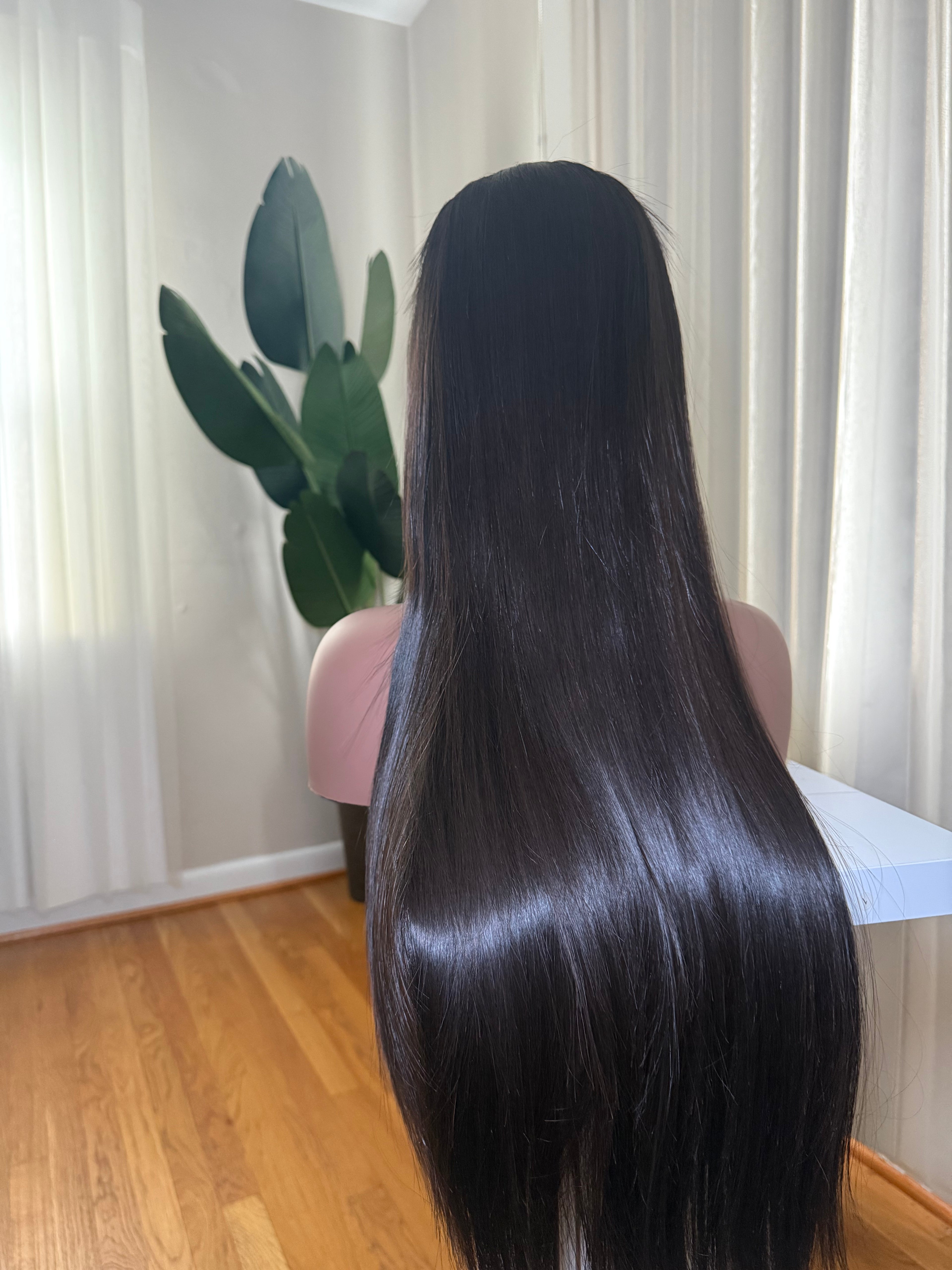 HER Vietnamese bone straight wig - side length view on mannequin